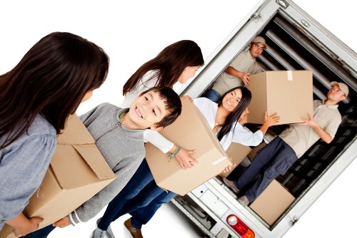 Removal team loading household items for a move in Tooting
