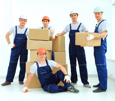 Moving team checking service notes and handling a complaint