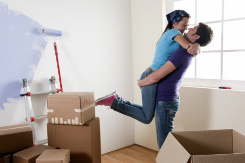 Moving team preparing safe lifting procedures during a relocation