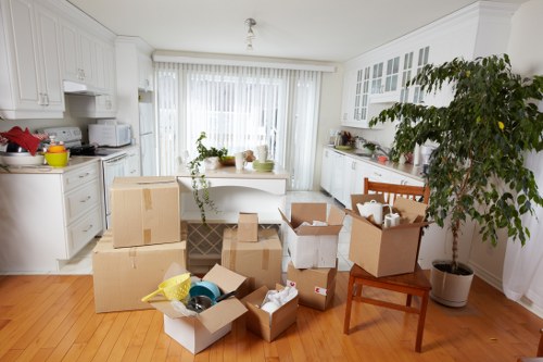 Local movers handling a stairwell move in a Tooting converted flat