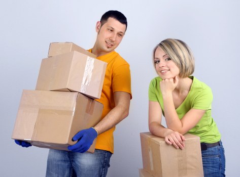 Office relocation planning with labels, packing materials, and documents