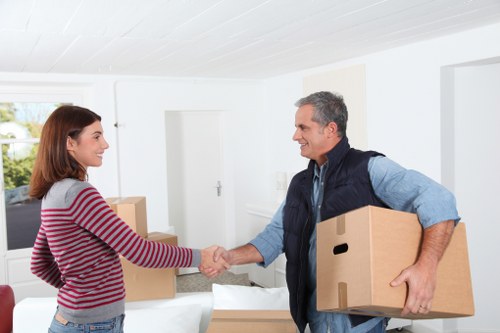 Local packing team working in a Tooting flat with limited access