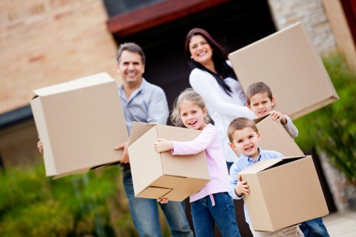 Professional movers handling household items with care