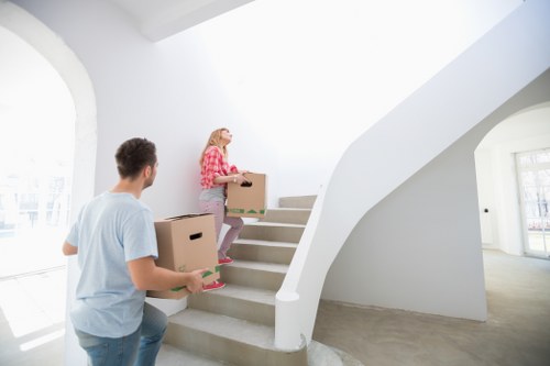 Packed household boxes and furniture ready for removal in Tooting