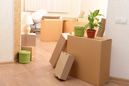 Movers coordinating safe handling in a property interior